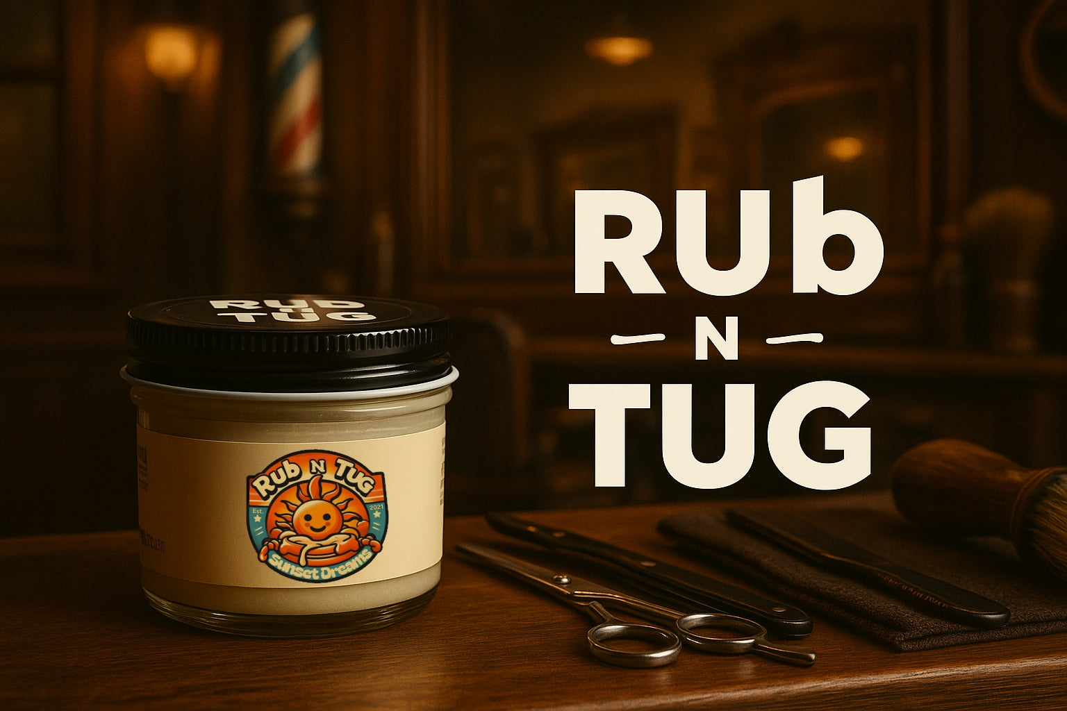 Rub N Tug ‘Sunset Dreams’ all-natural pomade jar on a barbershop counter, with scissors and grooming tools beside it, and a vintage-style barbershop pole in the blurred background. Brand name ‘Rub N Tug’ displayed in bold white letters!